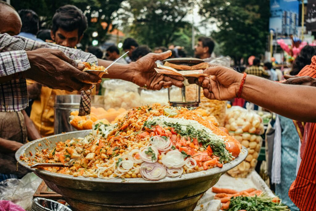 customers buying chaat and masala at food stalls 