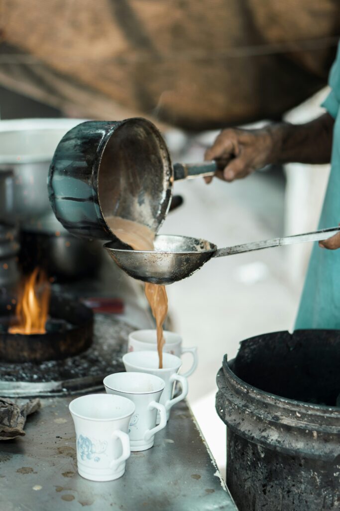 Hot tea being prepared by Tea maker at the roadside stall in Vijayawada